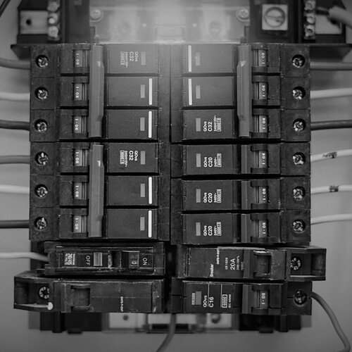 electrical service panel with exposed wiring